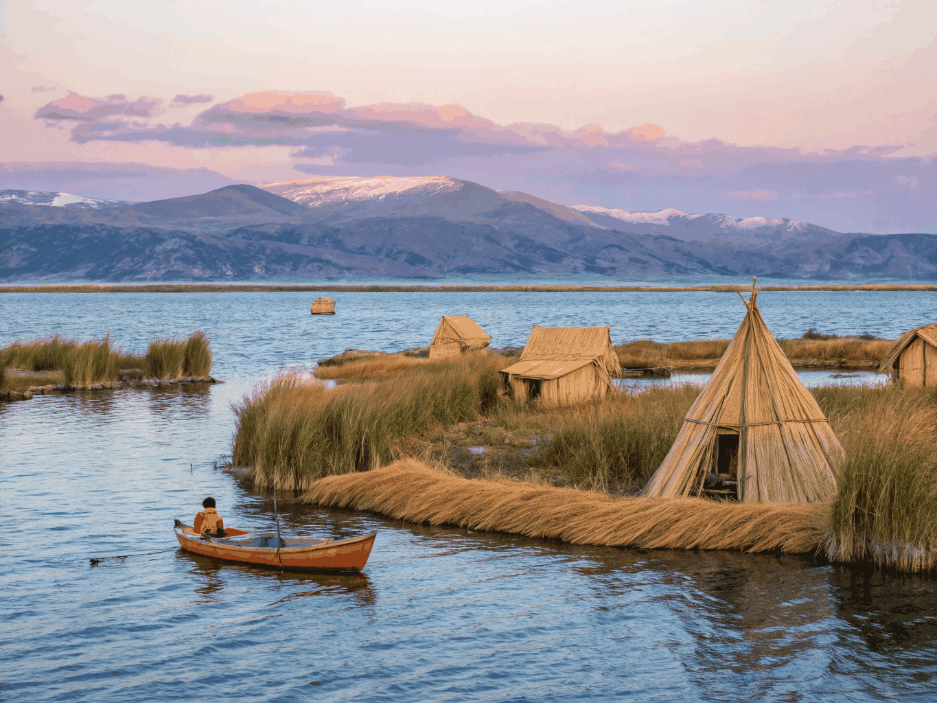 Traditional reed boats on the deep blue waters of Lake Titicaca